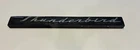 1963 - 1964 Thunderbird Script Emblem Oem (mounted) Used. Price: $35.00.