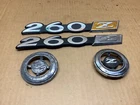 Vintage 1974 1975 Datsun 260Z Fender Emblems Oem Used Set. Price: $99.99.